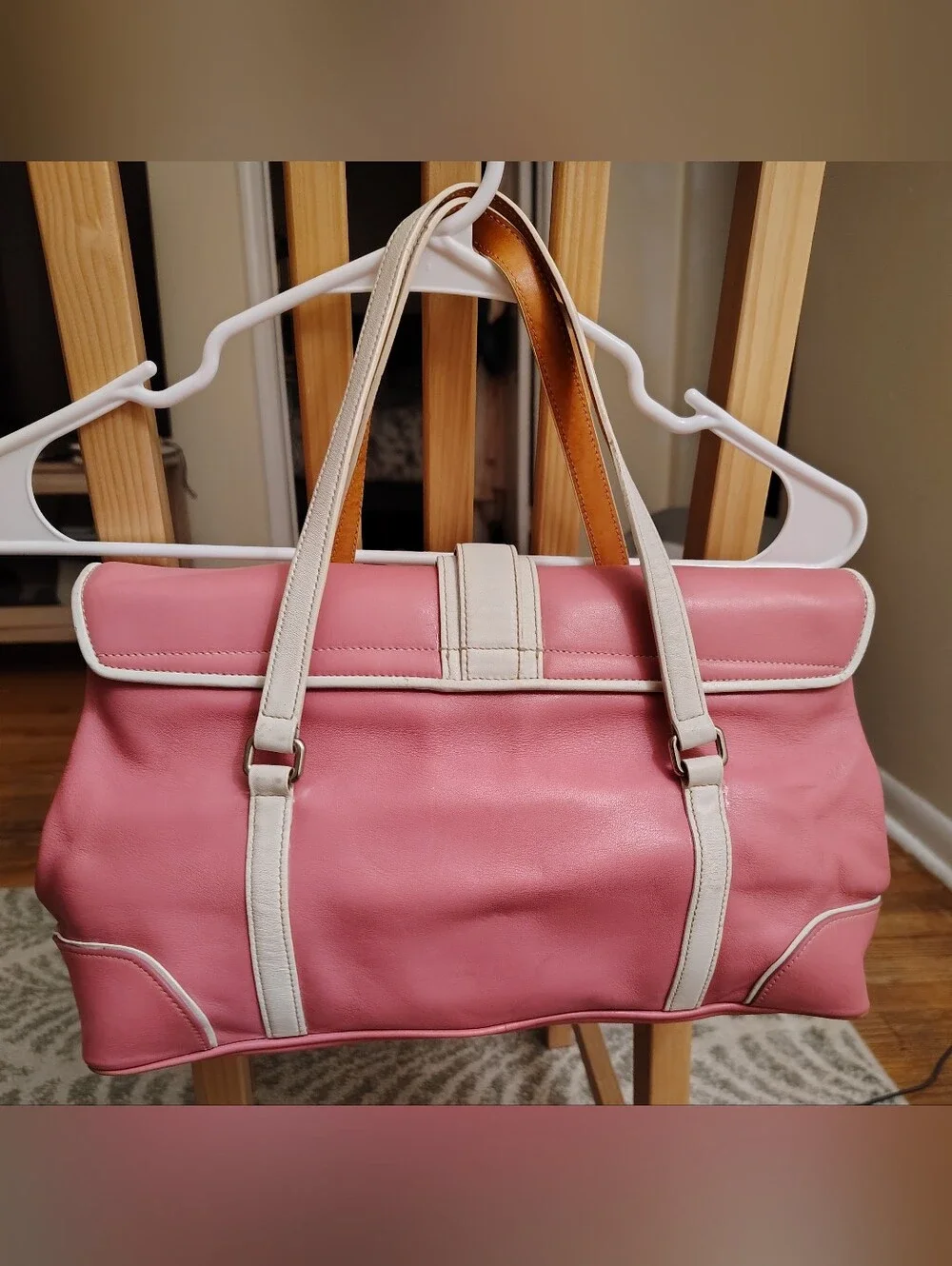 Coach Pink Shoulder Bag with White Trim and Buckle Detail.